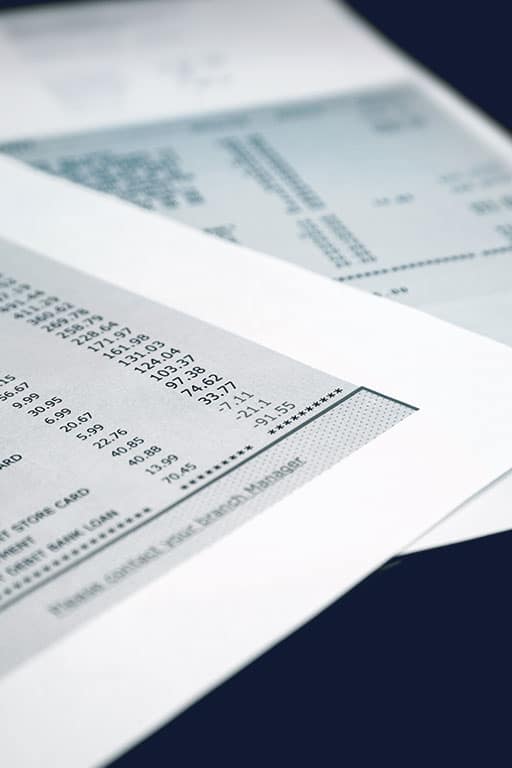 Close-up of a printed bank statement showing a column of transaction amounts